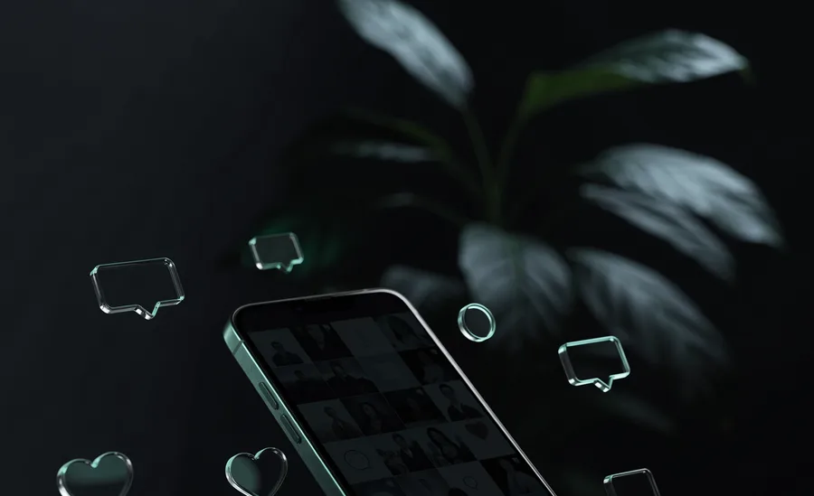 A phone showing a social grid with floating reaction cards, beside a camera